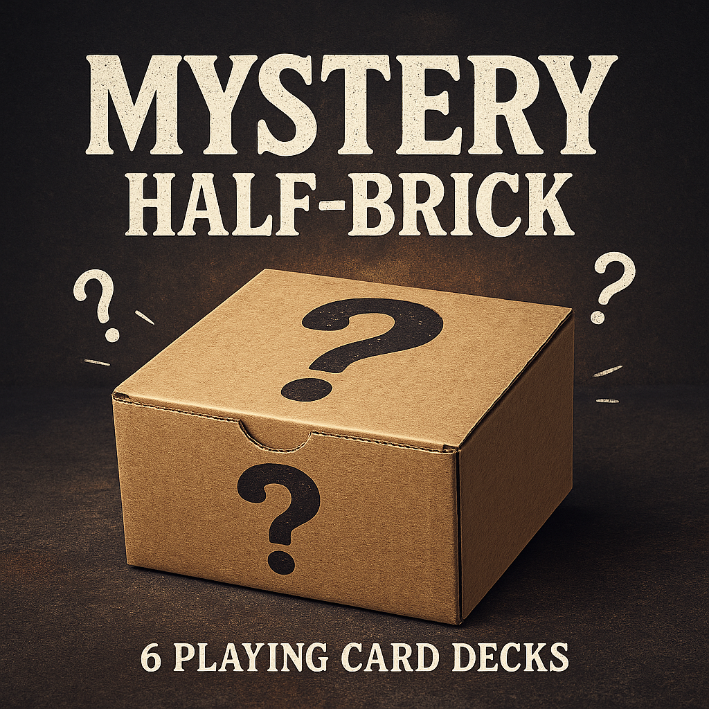 Cardboard box with question marks and text 'Mystery Half-Brick' and '6 Playing Card Decks' on a dark background